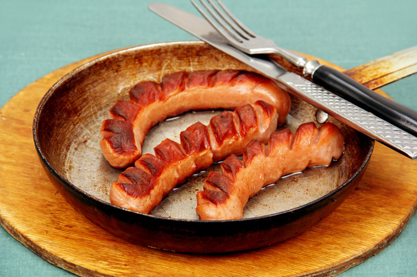 fried sausage in a skillet. - Photo, Image