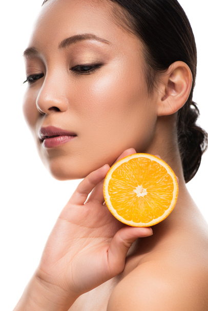 beautiful asian woman holding orange, isolated on white - Foto, Bild