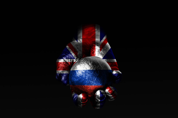 Çizilmiş büyük Britanya bayrağı ile bir el çizilmiş Rusya bayrağı, etki, baskı veya koruma ve koruma bir işareti ile bir top tutar. - Fotoğraf, Görsel