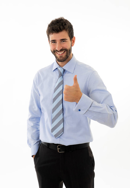 Half-length portrait of confident handsome caucasian businessman in fashion modern formal wear suit showing happy thumb up gesture. Isolated in white. Concept of People leadership and success. - Фото, зображення