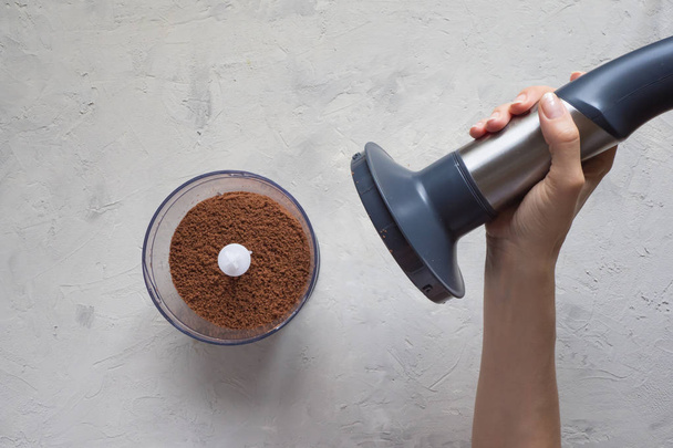 Process of grinding cacao beans in a blender. - Fotografie, Obrázek