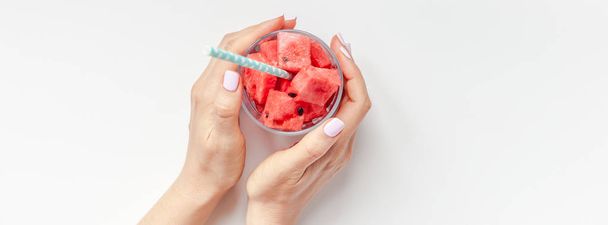 Woman hands with crushed watermelon in glass - Photo, Image