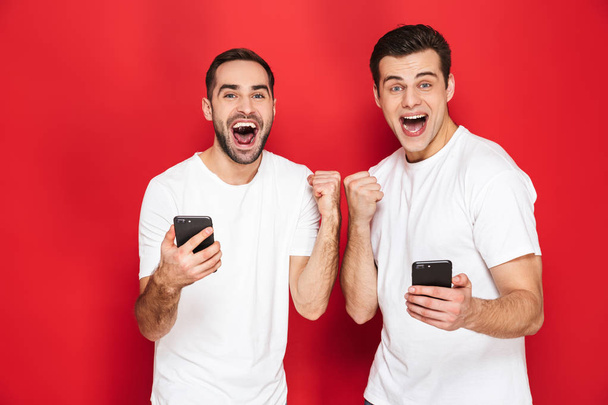 Two cheerful excited men friends - Photo, image