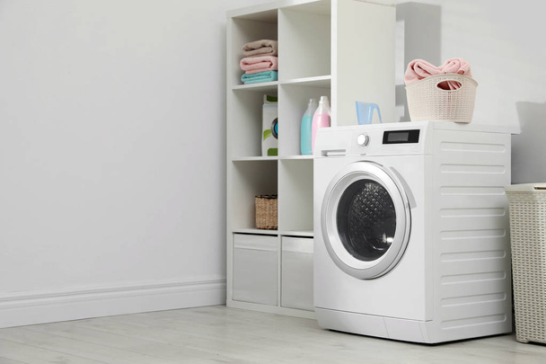 Modern washing machine in laundry room interior. Space for design - Foto, Bild