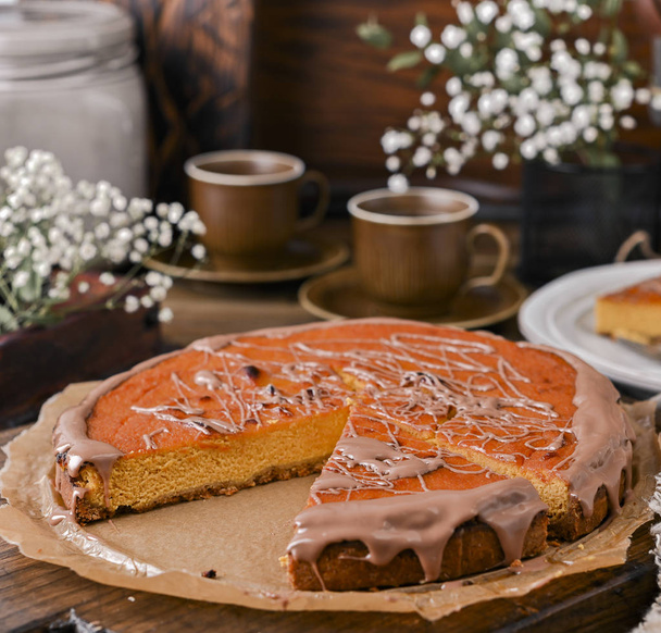 Cheesecake with chocolate and carrot puree. Vintage photo on woo - Zdjęcie, obraz