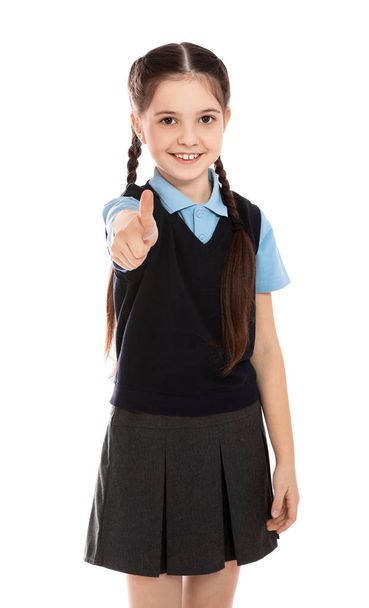 Portrait of cute girl in school uniform on white background - Photo, Image