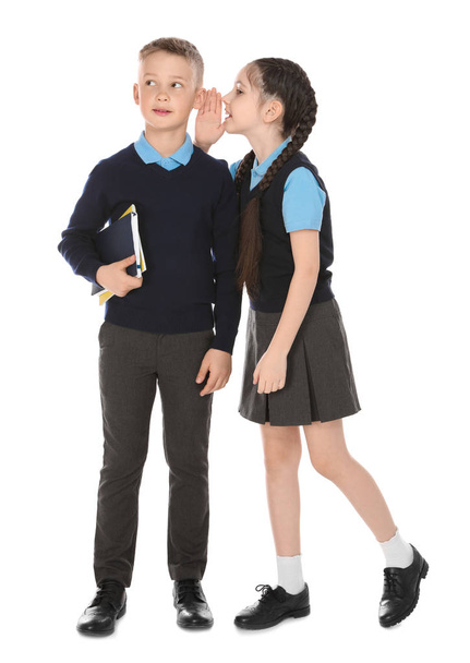 Full length portrait of cute children in school uniform on white background - Foto, Bild
