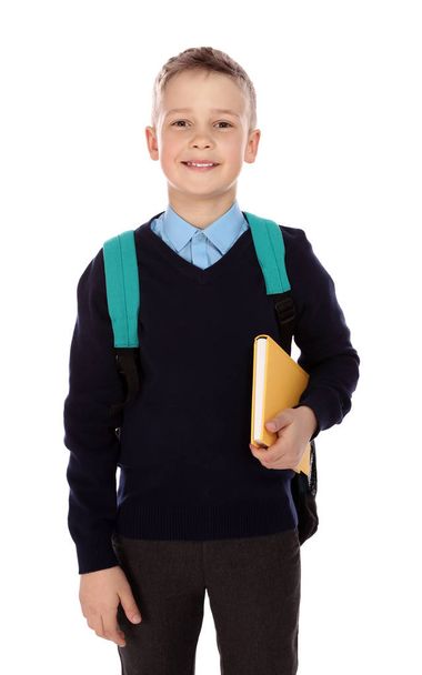 Portrait of cute boy in school uniform on white background - Zdjęcie, obraz