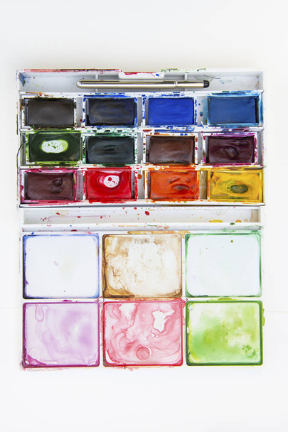 Set of watercolor paints isolated for painting closeup. Selective focus. Art, creative background with copy space. - Foto, afbeelding