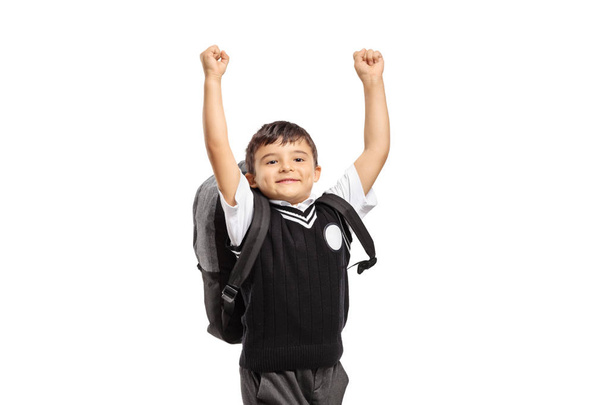 Happy schoolboy jumping isolated on white background - Fotoğraf, Görsel
