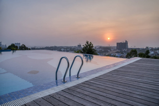 Sunset nearby swimming pool  - Photo, Image