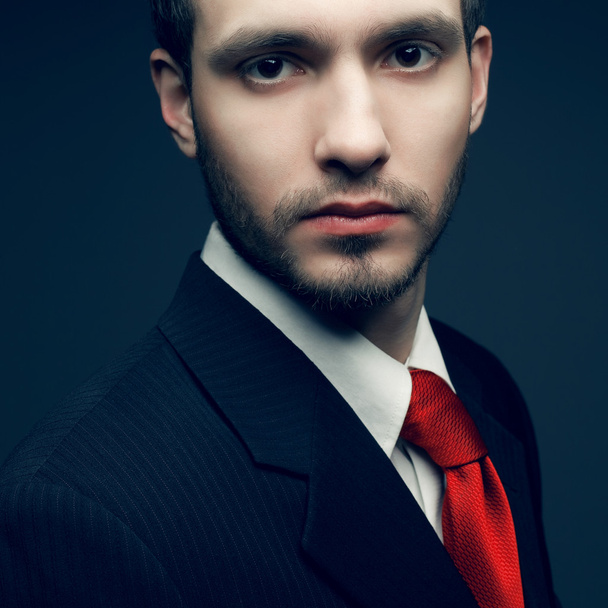 Portrait of a young handsome man (businessman) in black classic - Photo, image