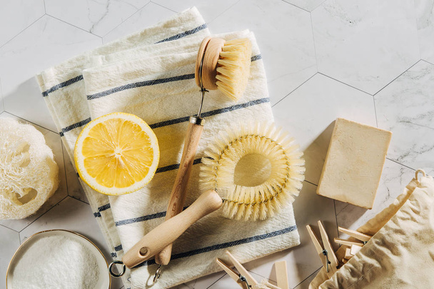 Eco friendly natural cleaning tools and products, bamboo dish brushes and lemon with baking soda. Zero waste concept. Plastic free. - Foto, Imagen