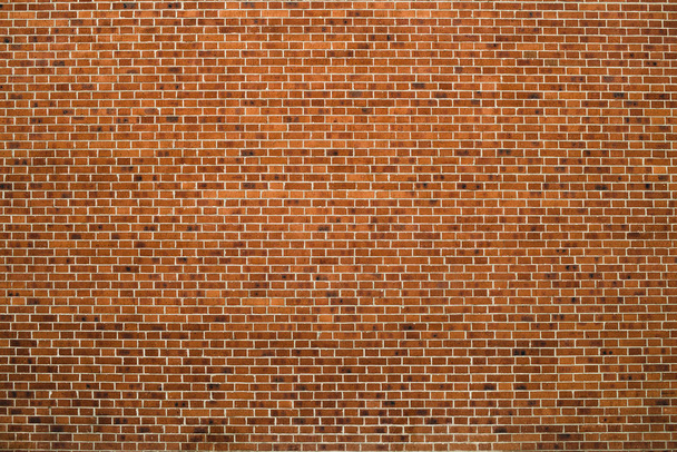Old realistic brick wall made of brown brick in different shads. Red smooth brickwork. - Zdjęcie, obraz
