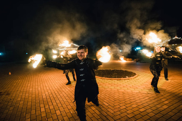 SEMIGORYE, IVANOVO OBLAST, RUSSIA - APRIL 28, 2017: Fire show with burning sparkling torches from professional artists - Photo, Image