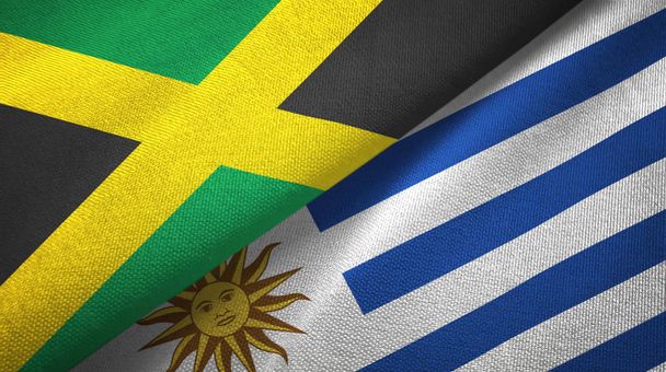 Jamajka a Uruguay dvě vlajky textilní tkaniny, textura - Fotografie, Obrázek