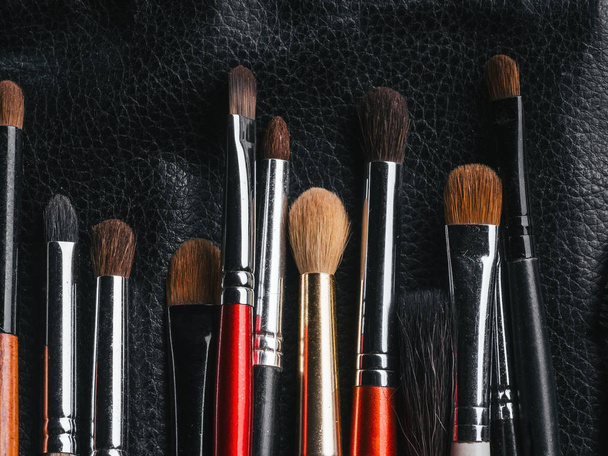 set of professional makeup brushes in leather black case - Photo, Image