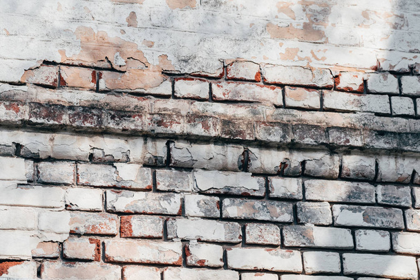 texture of old brick wall with peeling plaster - Fotografie, Obrázek