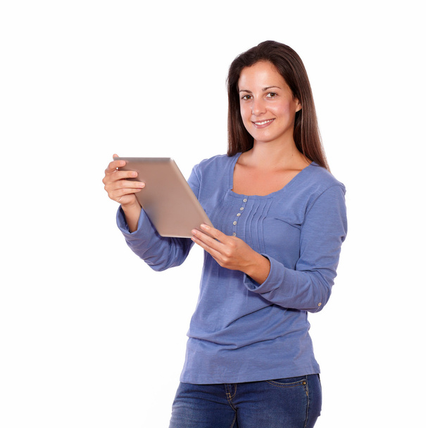 Pretty female working on tablet pc while standing - Photo, Image