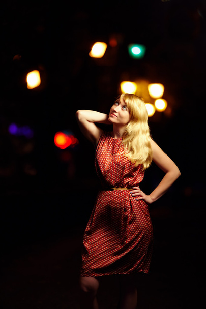 beautiful elegante woman on city lights background - Fotografie, Obrázek