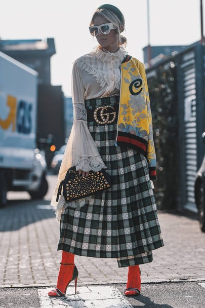 Milan, Italy - February 20, 2019: Street style - woman wearing Gucci after a fashion show during Milan Fashion Week - MFWFW19 - Zdjęcie, obraz