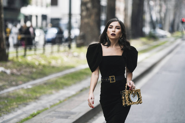 Milan, Italy - February 24, 2019: Street style Influencer Karina Nigay wearing a Dolce & Gabbana purse at a fashion show during Milan Fashion Week - MFWFW19 - Foto, Imagen