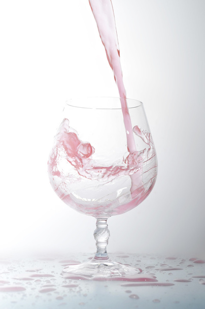 Liquid in wineglass - Фото, изображение