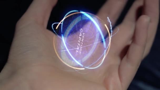 Venture Capital text hologram on a female hand - Footage, Video
