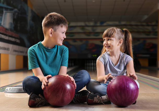 Little children with balls in bowling club - Fotoğraf, Görsel