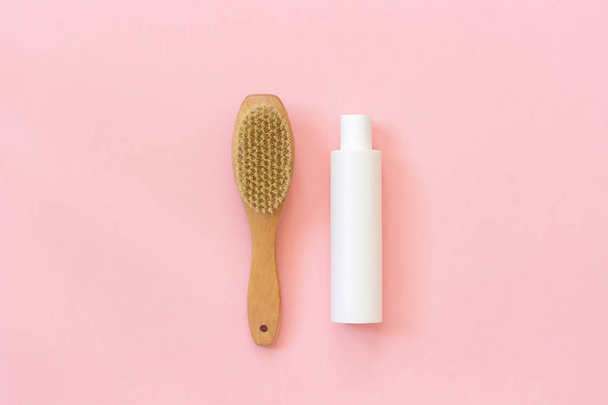 Natural eco brush and white bottle of cream for massage, peeling and body care. Concept of beautiful, healthy body and fight against cellulite. Template Copy space Top view - Φωτογραφία, εικόνα