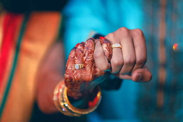 Golden engagement ring in hand - Foto, imagen