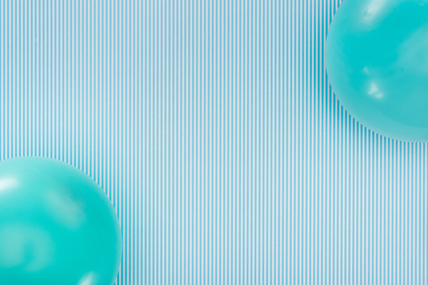 Top view of blue balloons on striped blue background - Fotografie, Obrázek
