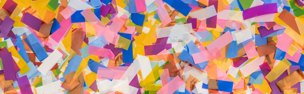 Panoramic shot of multicolored confetti festive background - Foto, immagini