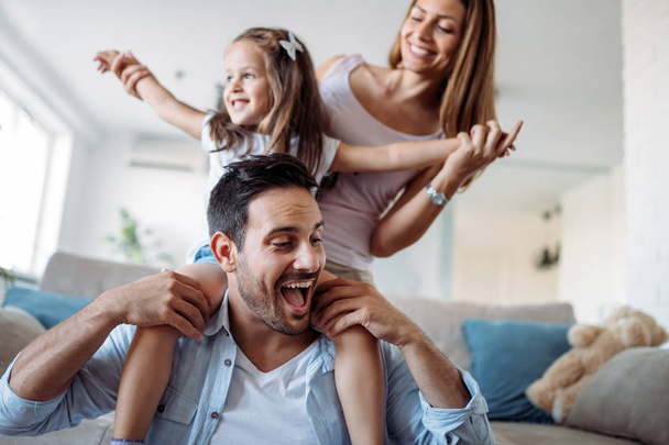 Happy family having fun time at home - Фото, зображення