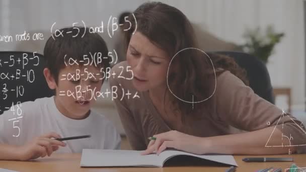 Digital composite of Caucasian mother teaching son at home while mathematical equations move in the foreground - Footage, Video