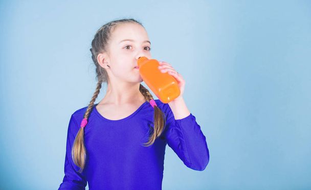 Little girl drink water from bottle. Happy child sportsman. Fitness and diet. Energy. Relax after gym workout of teen girl. Success. Childhood activity. Sport and health. Staying hydrated. So thirsty - Zdjęcie, obraz