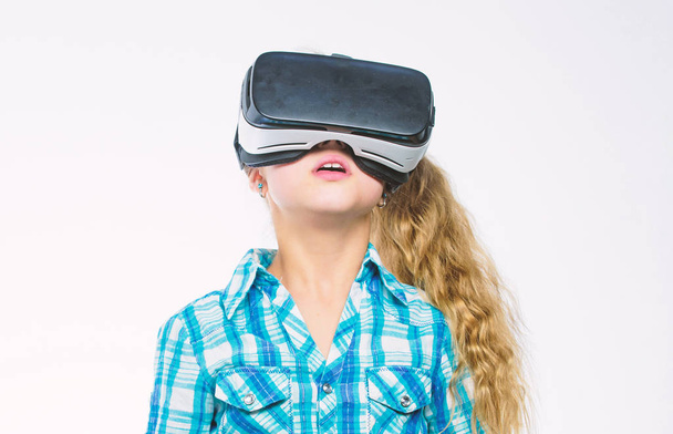 Girl cute child with head mounted display on white background. Virtual education for school pupil. Get virtual experience. Virtual reality concept. Small kid use modern technology virtual reality - 写真・画像