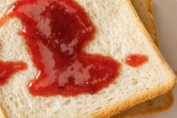 close up view of toasts with jam on white plate - Photo, Image