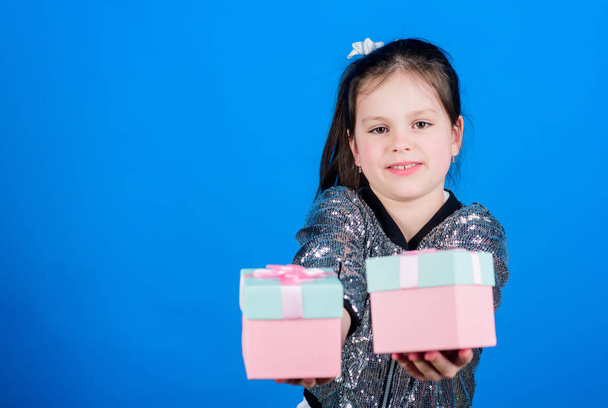 Girl with gift boxes blue background. Black friday. Shopping day. Cute child carry gift boxes. Surprise gift box. Birthday wish list. World of happiness. Special happens every day. Choose one - Foto, Bild