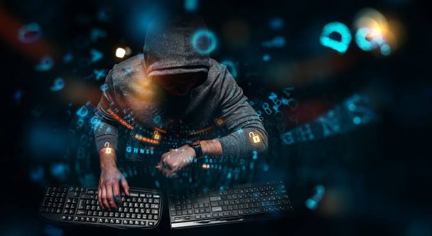 Hacker in hoodie dark theme - Photo, image