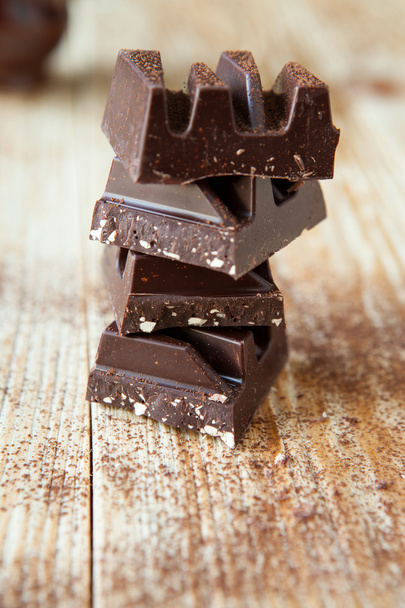 stack of dark chocolate pieces - Foto, Imagem