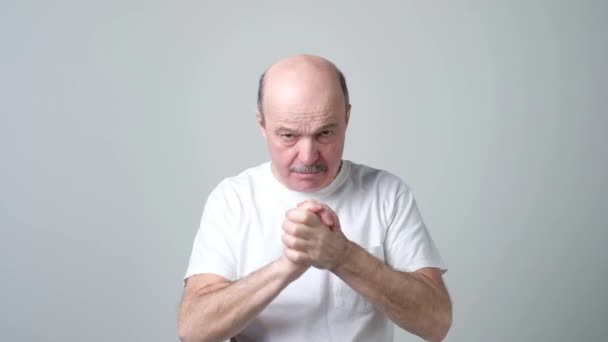 Senior man holding fist together. - Footage, Video
