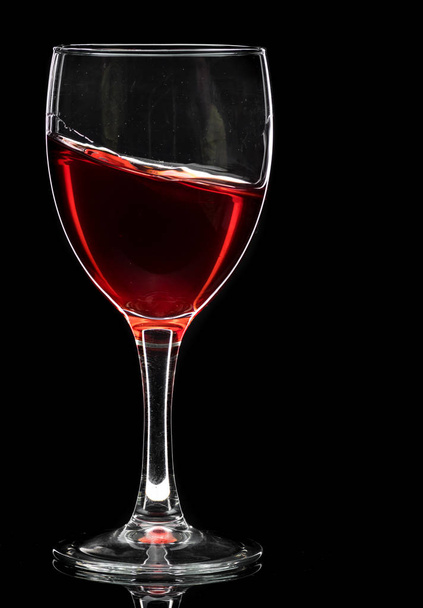 Wine glass with red wine or empty on black background - Foto, afbeelding