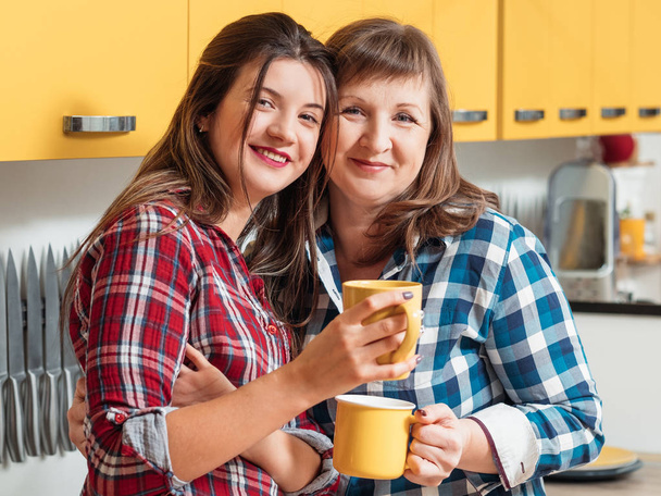 family relationships mother daughter tea cups bond - Fotografie, Obrázek