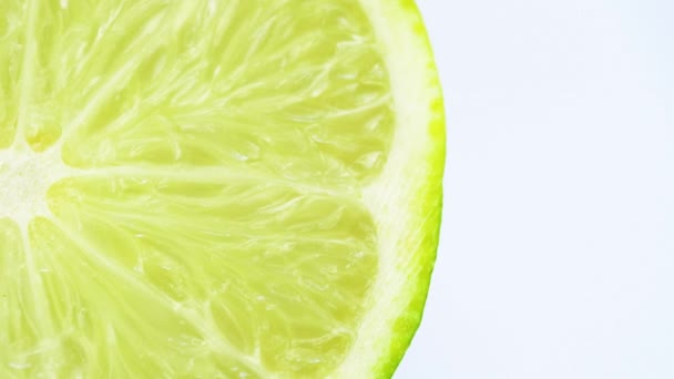 Macro shot of rotating sliced lime. 4k close up footage. - Footage, Video