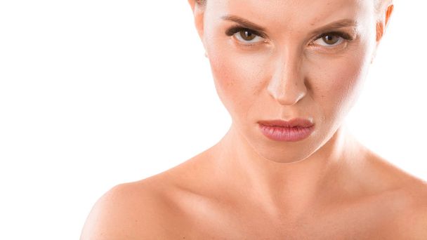 Close up portrait of a woman with an angry face. Isolated on white. Facial expressions and emotions. - Foto, Bild