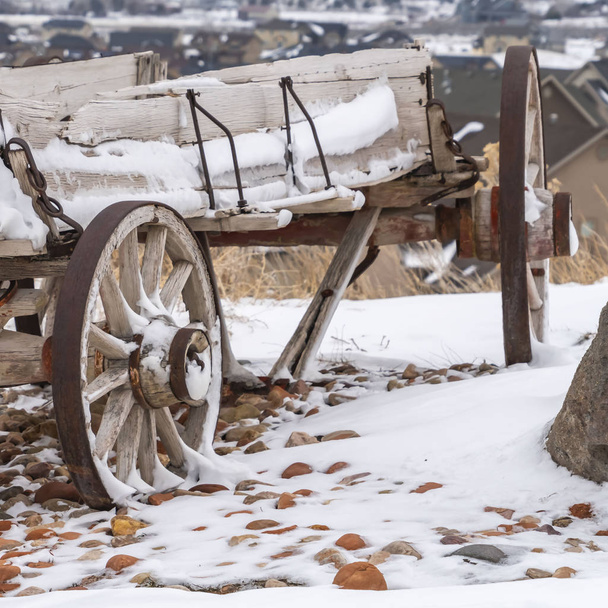 Clear Square Old wooden wagon with chains and rusty wheels dusted with snow in winter - Photo, Image