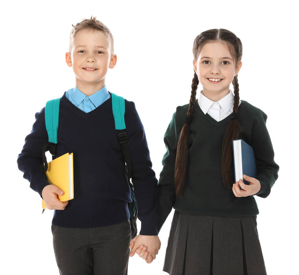 Portrait of cute children in school uniform on white background - Foto, Bild