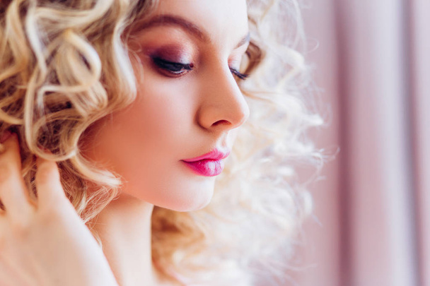 Beautiful portrait with professional makeup for a bachelorette party. Girl blonde with curly hair. - Фото, изображение
