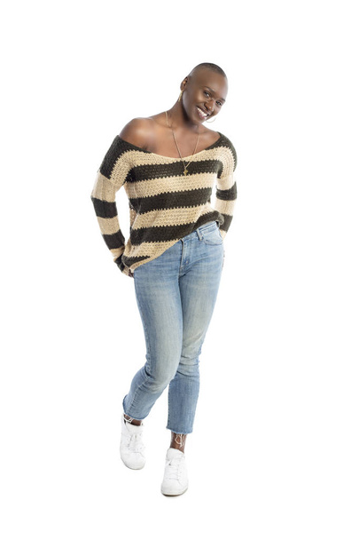 Black African American female fashion model wearing spring style wool knit long sleeve shirt or sweater.  She has a bald hairstyle and looks confident on a white background.  - Foto, immagini